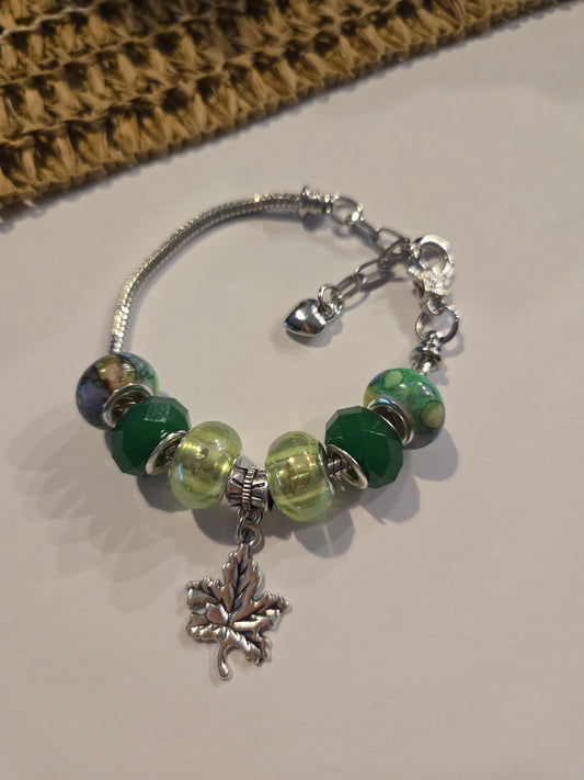 Silver Charm Bracelet with Green Tones and Leaf Charm expandable to 19cm